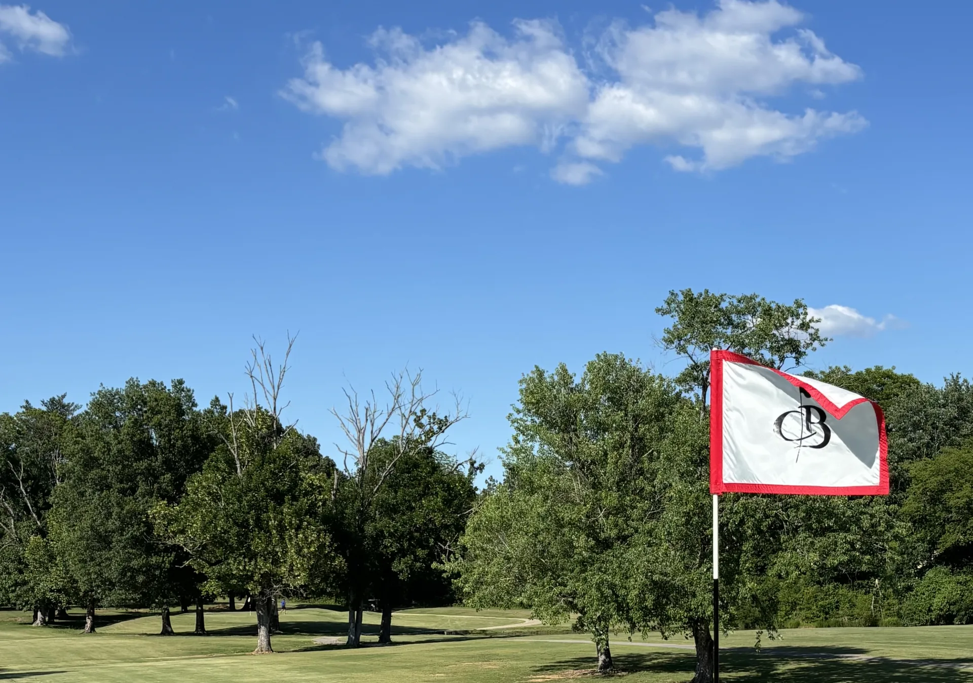 Hole 16 flag under blue sky